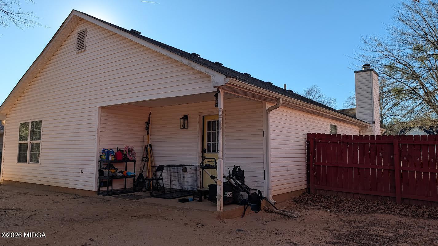 167 Apple Valley Road Macon, GA 31217 - Photo 21 of 22 a view of a house with a backyard and a garage
