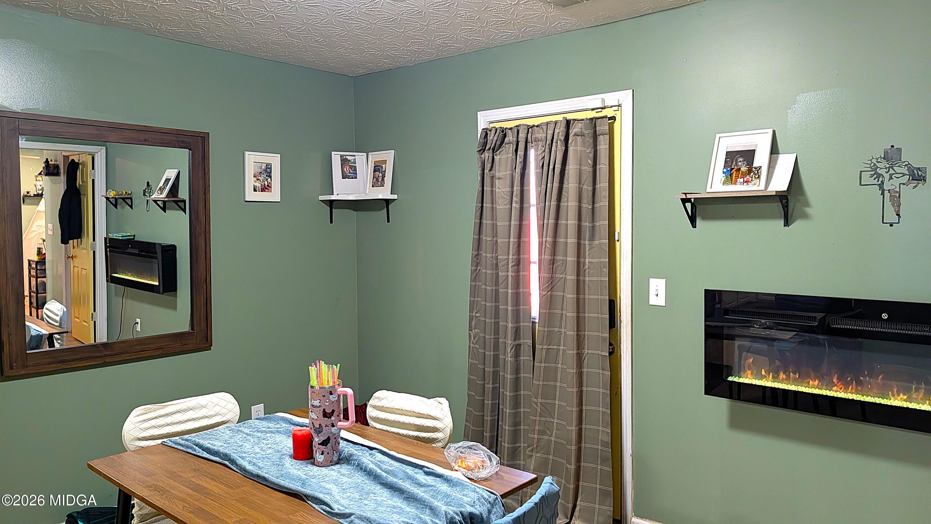 167 Apple Valley Road Macon, GA 31217 - Photo 10 of 22 a living room with furniture and a fireplace