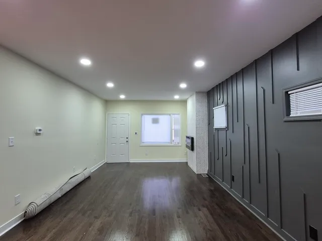 a view of gallery with wooden floor