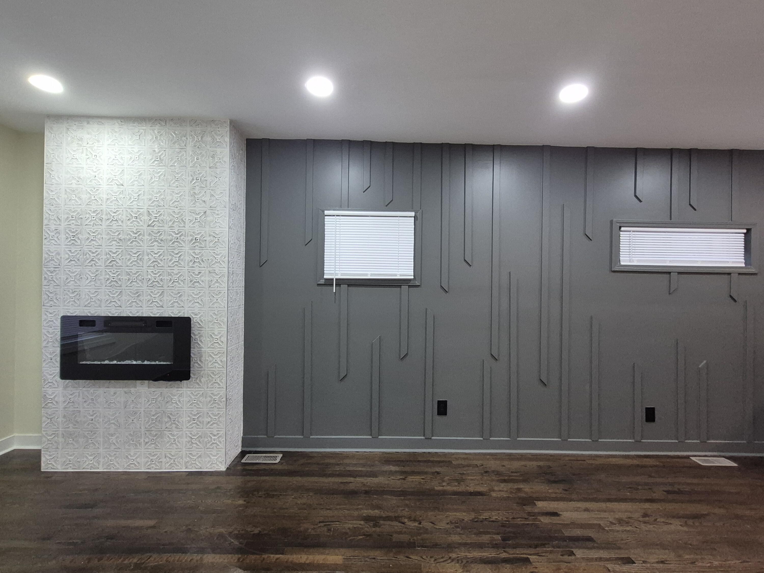308 Pierce Street Gary, IN 46402 - Photo 6 of 25 a view of a hallway with wooden floor and a fireplace
