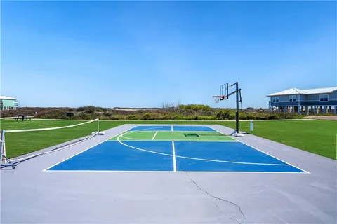 a view of outdoor space with swimming pool and green space