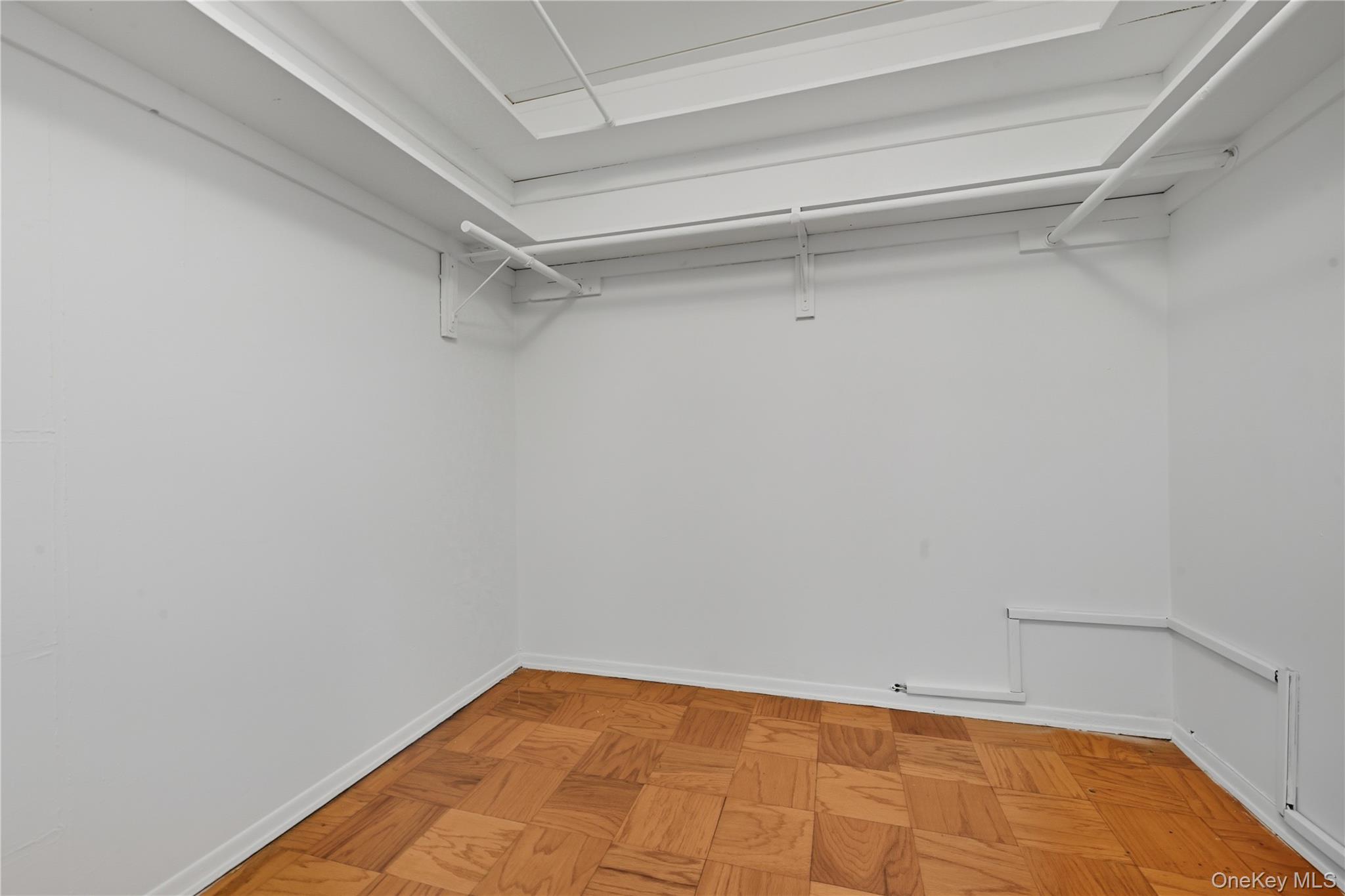 100 Clinton Avenue, Unit 2J Mineola, NY 11501 - Photo 15 of 24 a view of a room with shelf on the wall