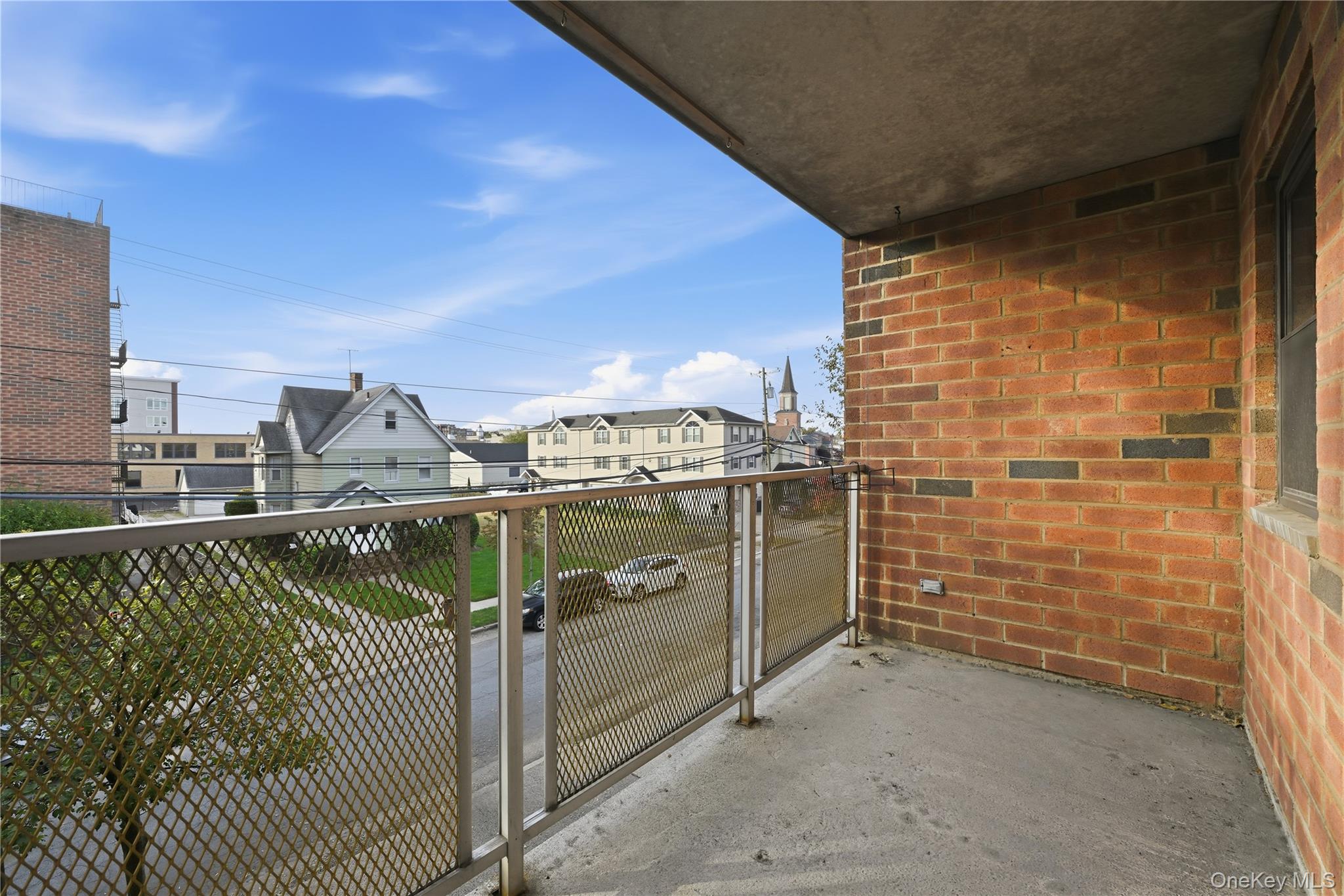 100 Clinton Avenue, Unit 2J Mineola, NY 11501 - Photo 17 of 24 a view of a balcony with an outdoor space