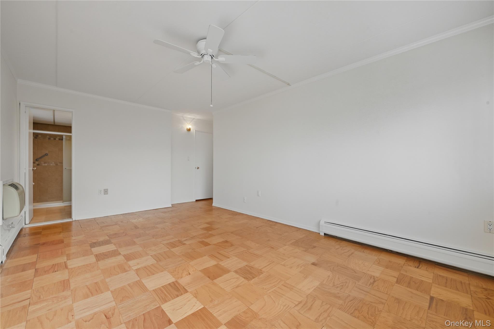 100 Clinton Avenue, Unit 2J Mineola, NY 11501 - Photo 9 of 24 a view of an empty room