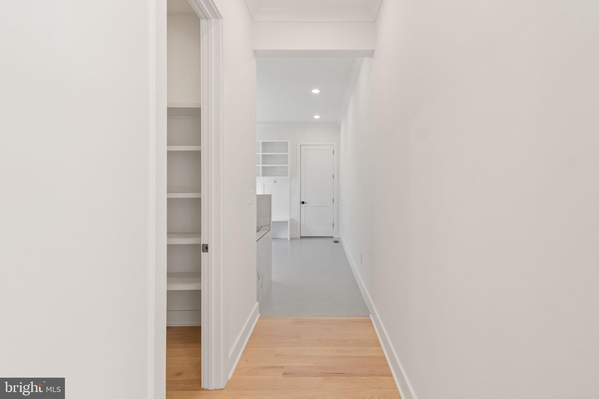4017 Woodland Road Annandale, VA 22003 - Photo 29 of 76 a view of a hallway with wooden floor