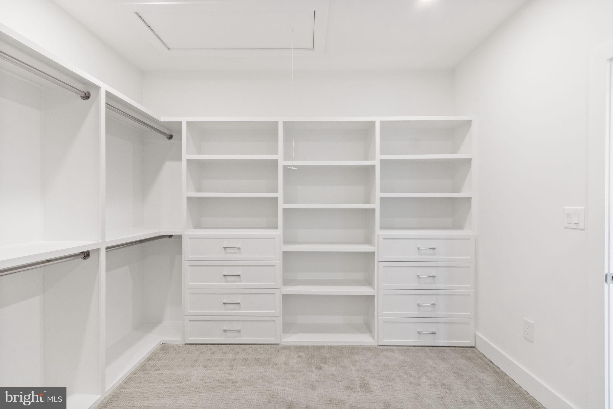 4017 Woodland Road Annandale, VA 22003 - Photo 39 of 76 a view of walk in closet with empty racks