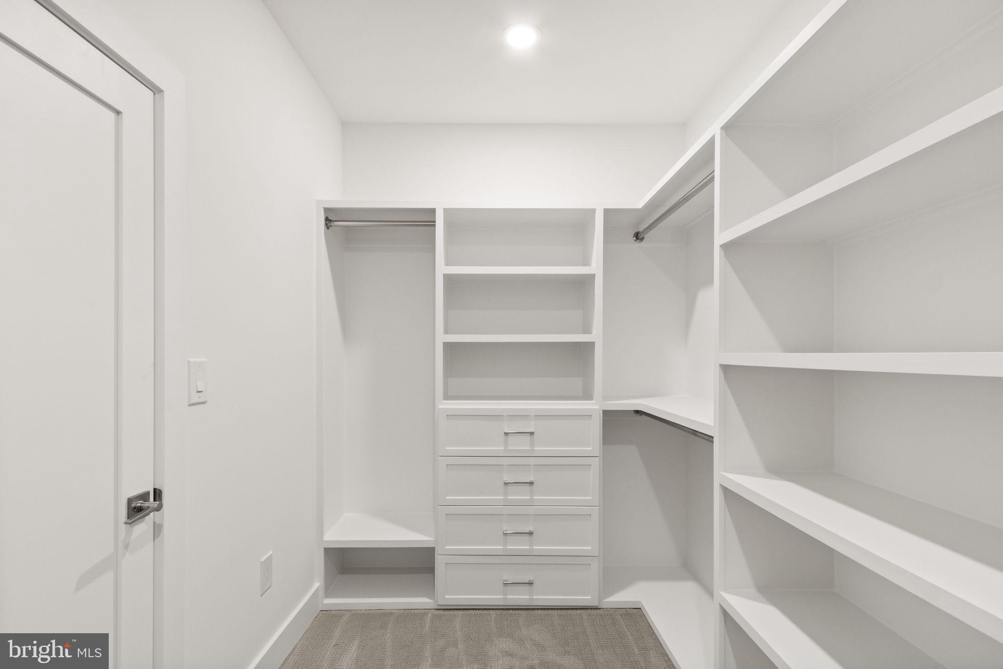 4017 Woodland Road Annandale, VA 22003 - Photo 40 of 76 a view of walk in closet with empty racks
