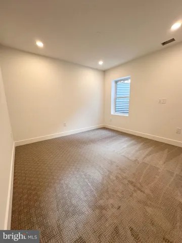 an empty room with a empty space and window