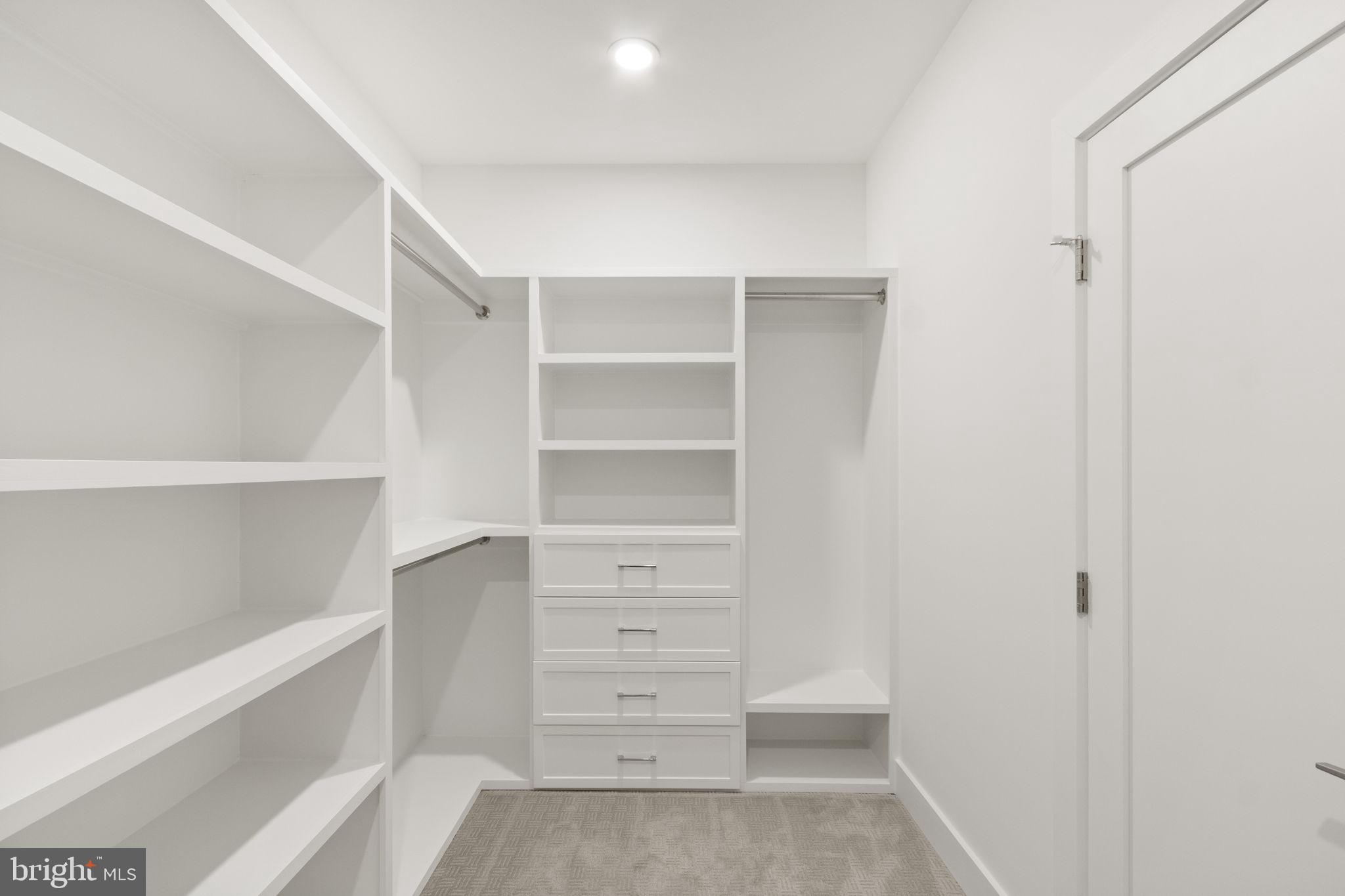 4017 Woodland Road Annandale, VA 22003 - Photo 41 of 76 a view of walk in closet with empty racks