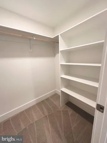 a view of an empty walk in closet