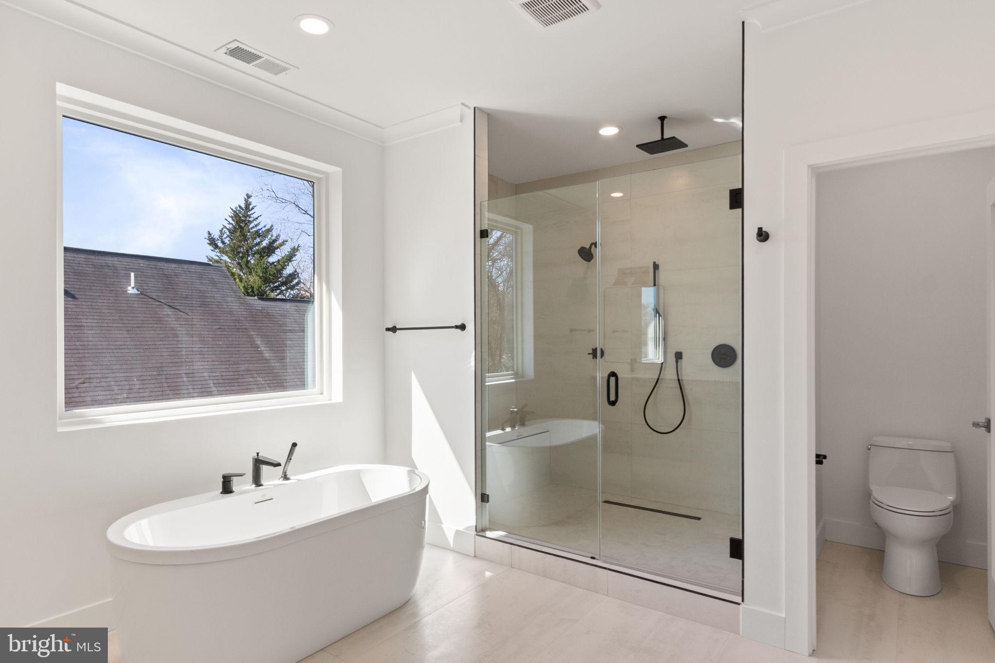 4017 Woodland Road Annandale, VA 22003 - Photo 46 of 76 a bathroom with a sink a toilet and shower