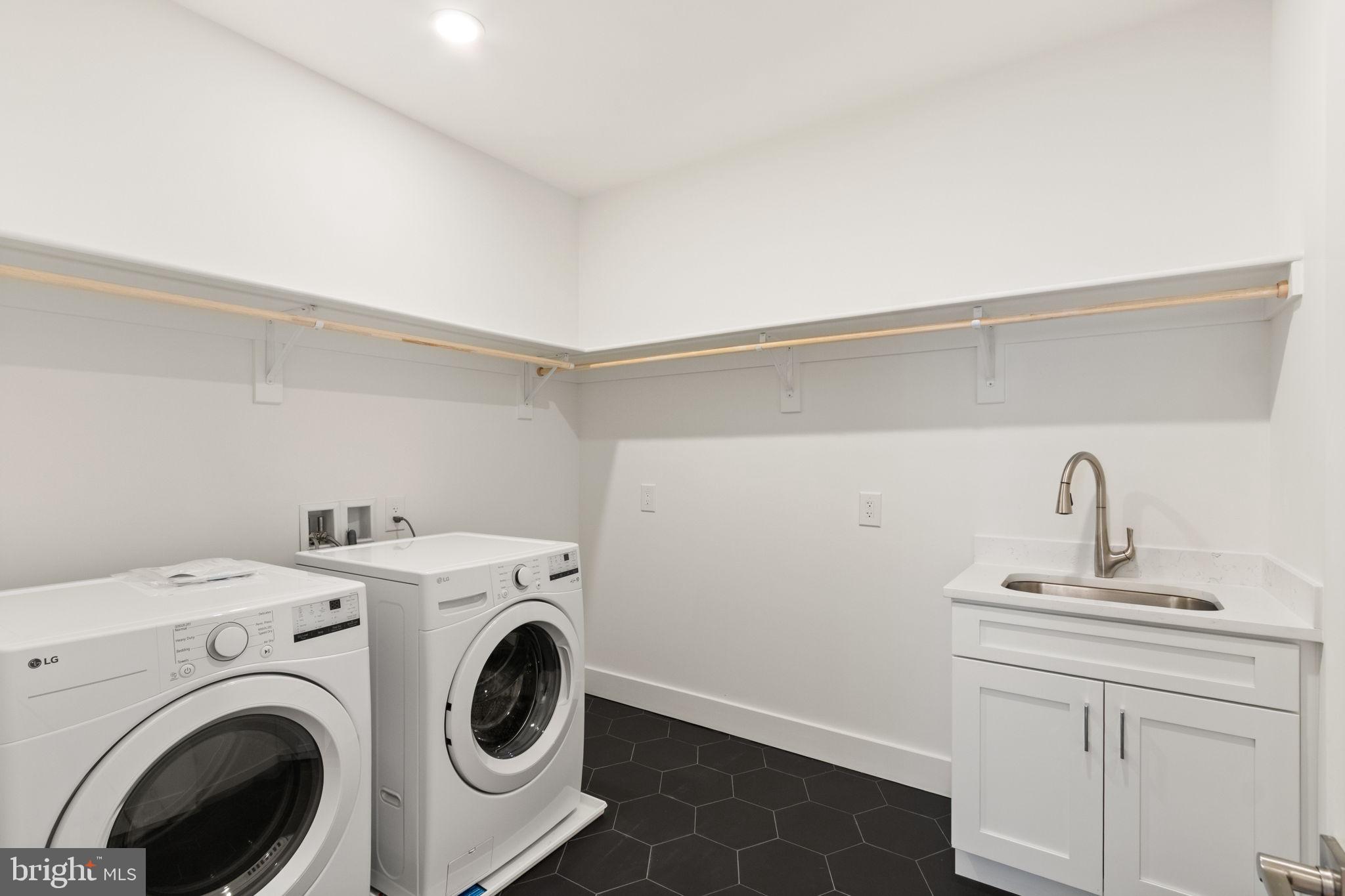 4017 Woodland Road Annandale, VA 22003 - Photo 54 of 76 a utility room with dryer and washer