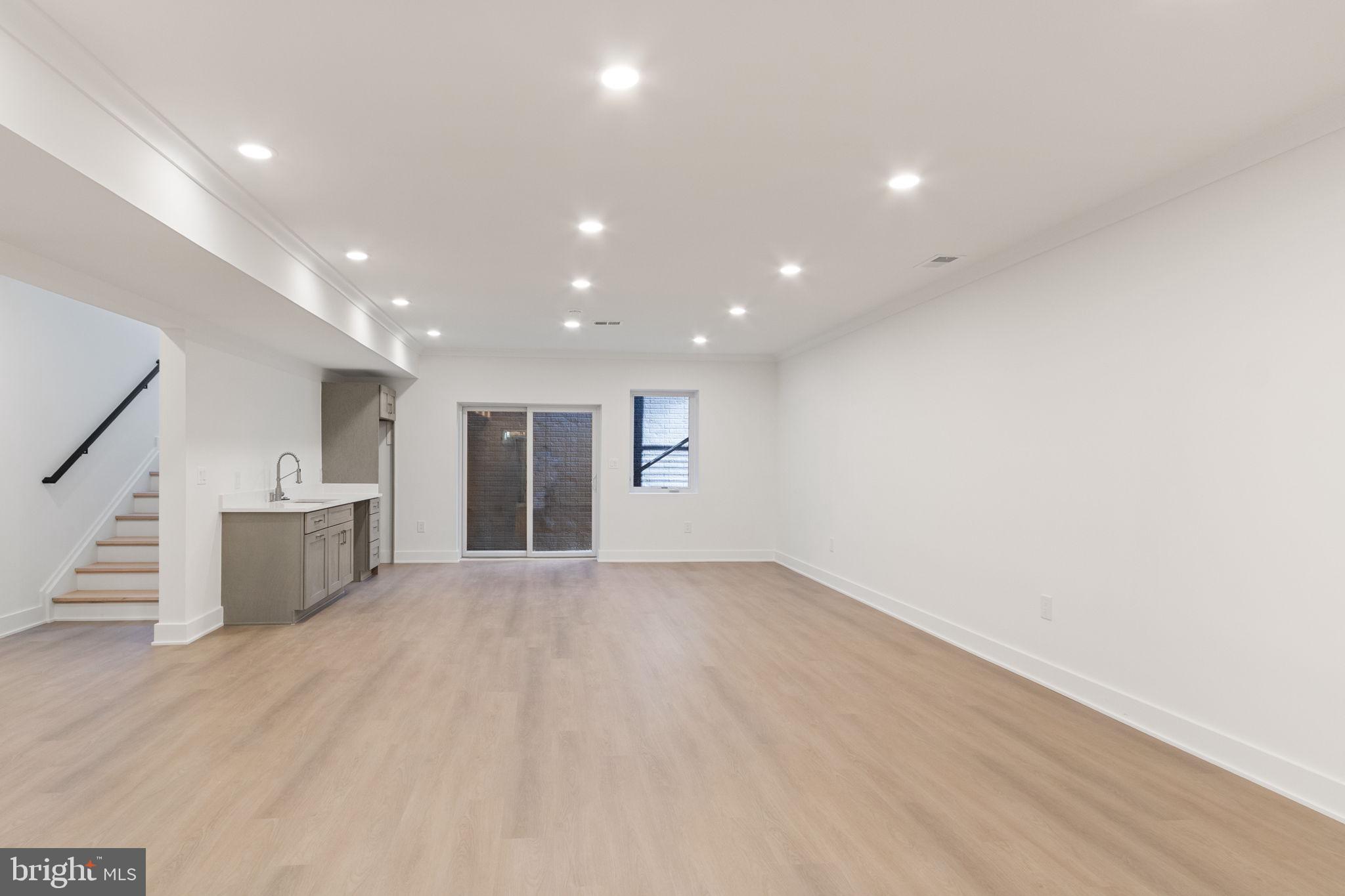 4017 Woodland Road Annandale, VA 22003 - Photo 66 of 76 a view of a big room with wooden floor and windows