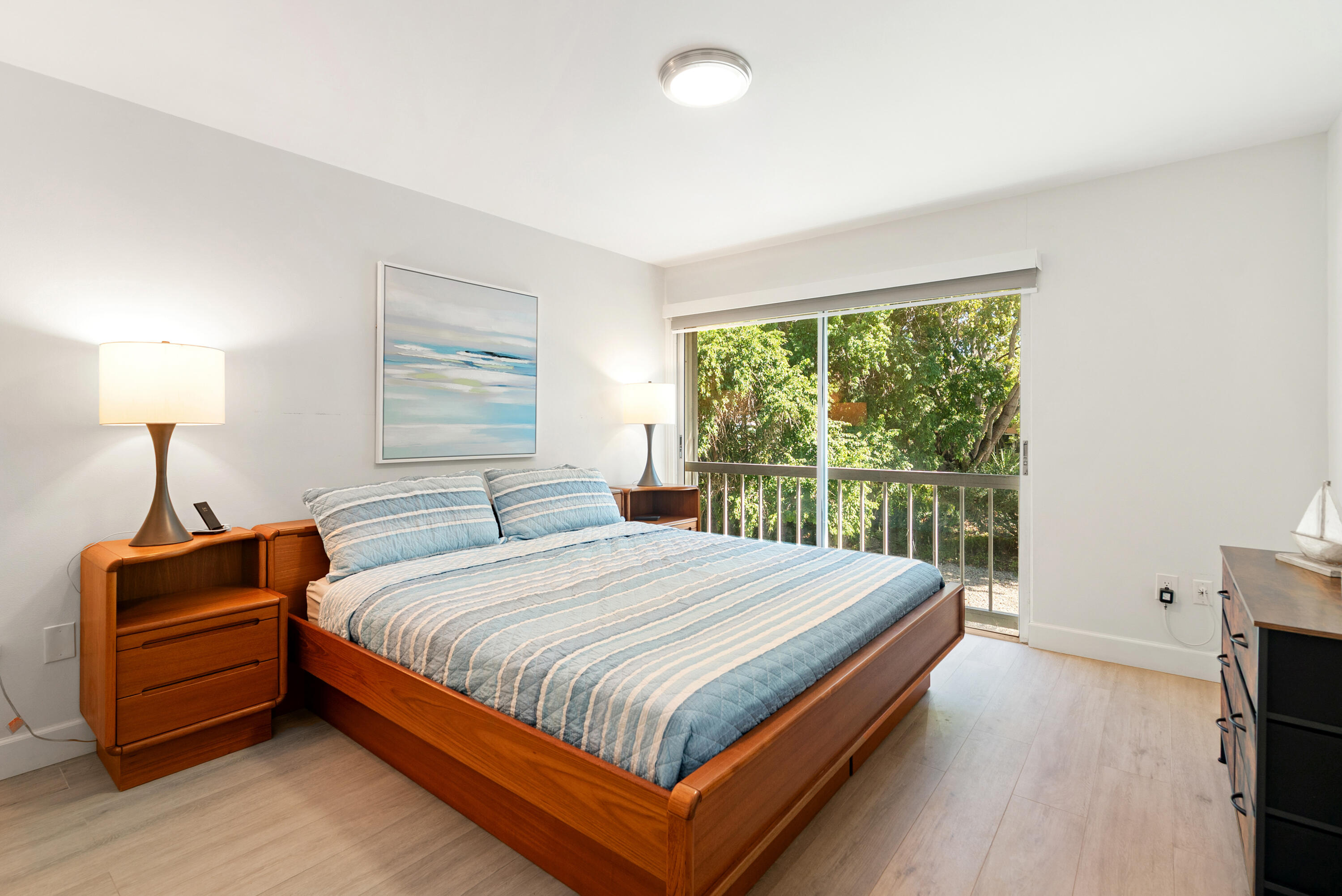 9871 Leeward Avenue Key Largo, FL 33037 - Photo 11 of 38 a bedroom with a bed and a tv