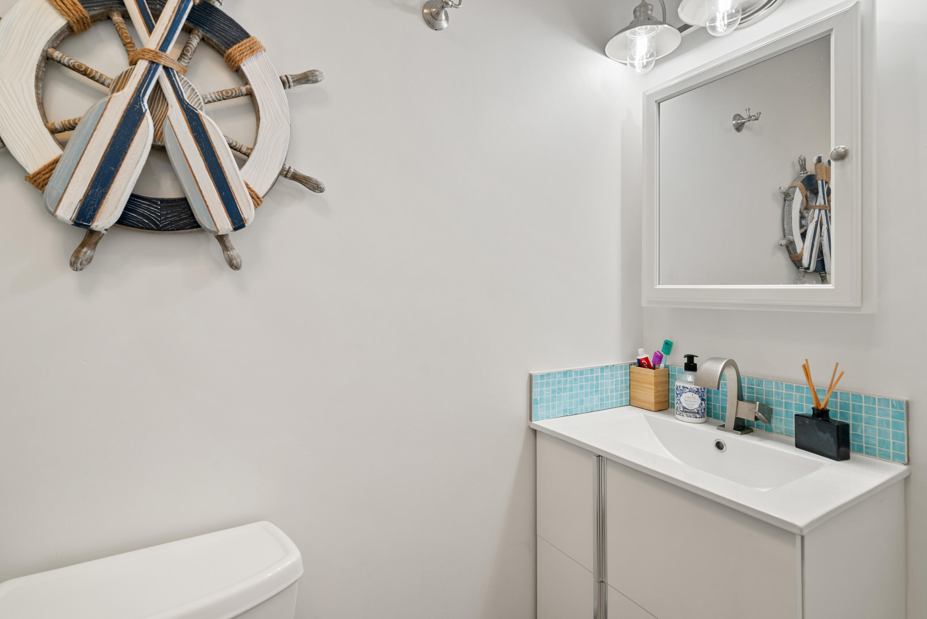 9871 Leeward Avenue Key Largo, FL 33037 - Photo 18 of 38 a bathroom with a sink vanity and toilet