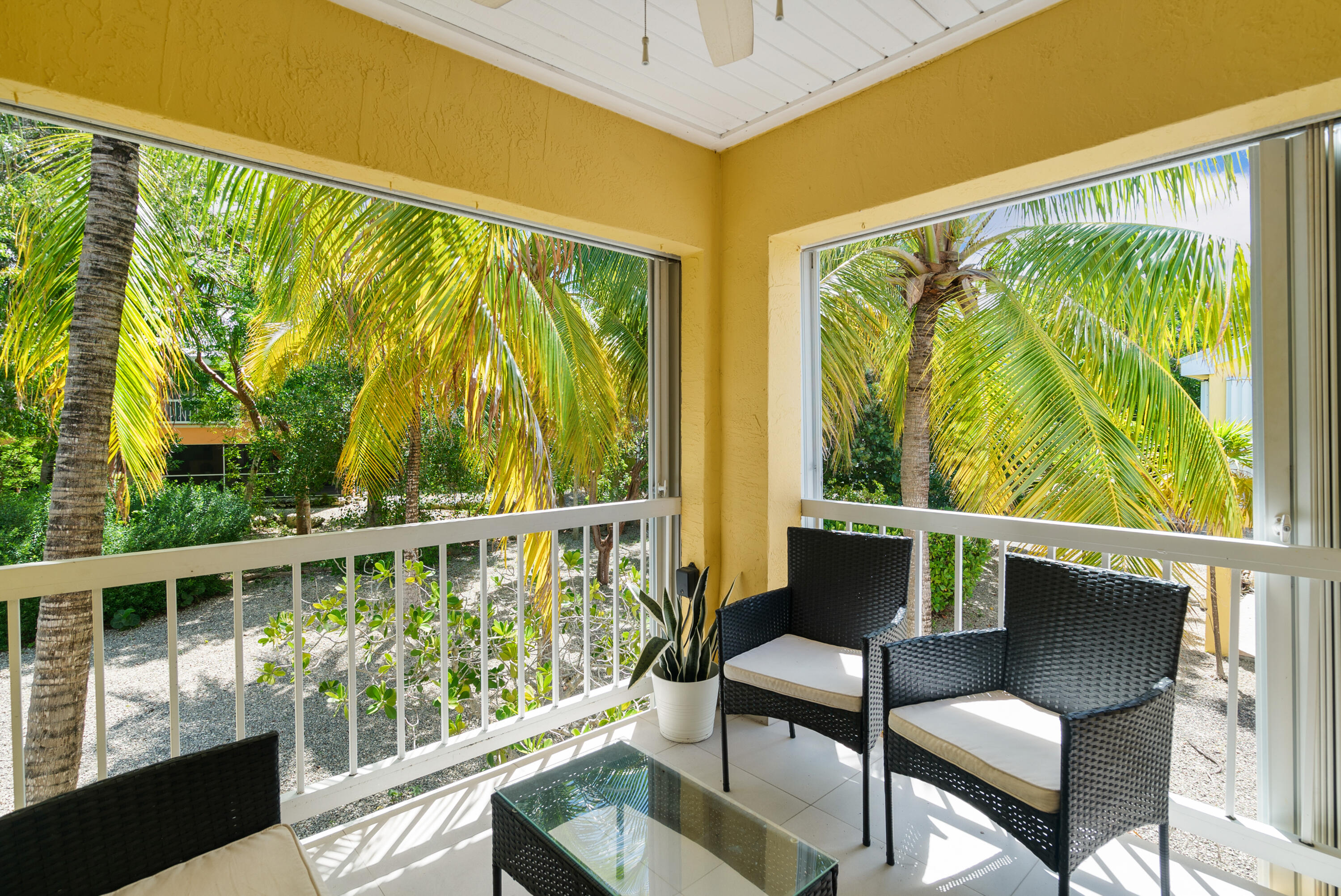 9871 Leeward Avenue Key Largo, FL 33037 - Photo 2 of 38 a view of a two chair in the balcony
