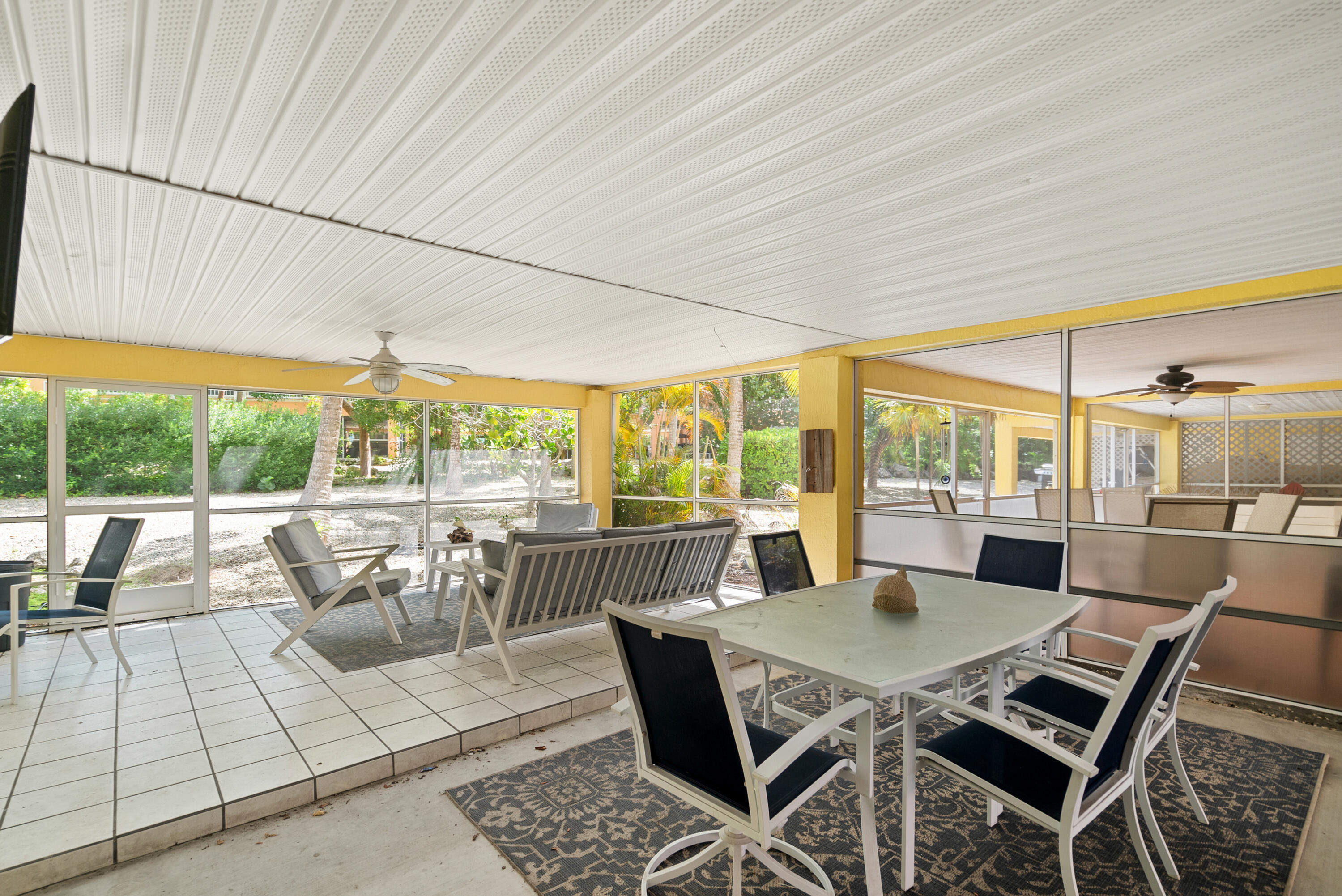 9871 Leeward Avenue Key Largo, FL 33037 - Photo 21 of 38 a view of a dining room with furniture window and outside view