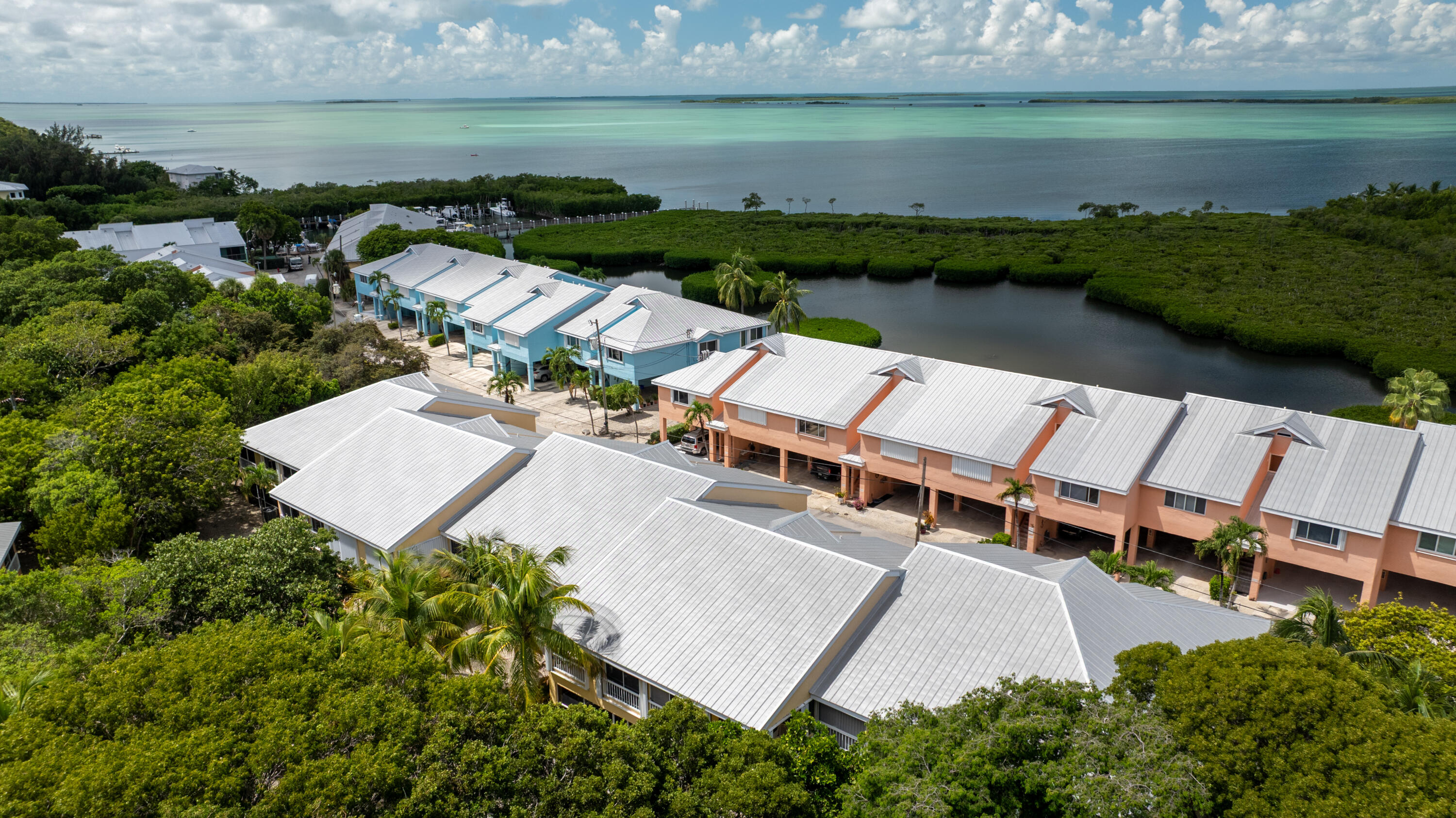 9871 Leeward Avenue Key Largo, FL 33037 - Photo 24 of 38 an aerial view of a house with garden space and lake view
