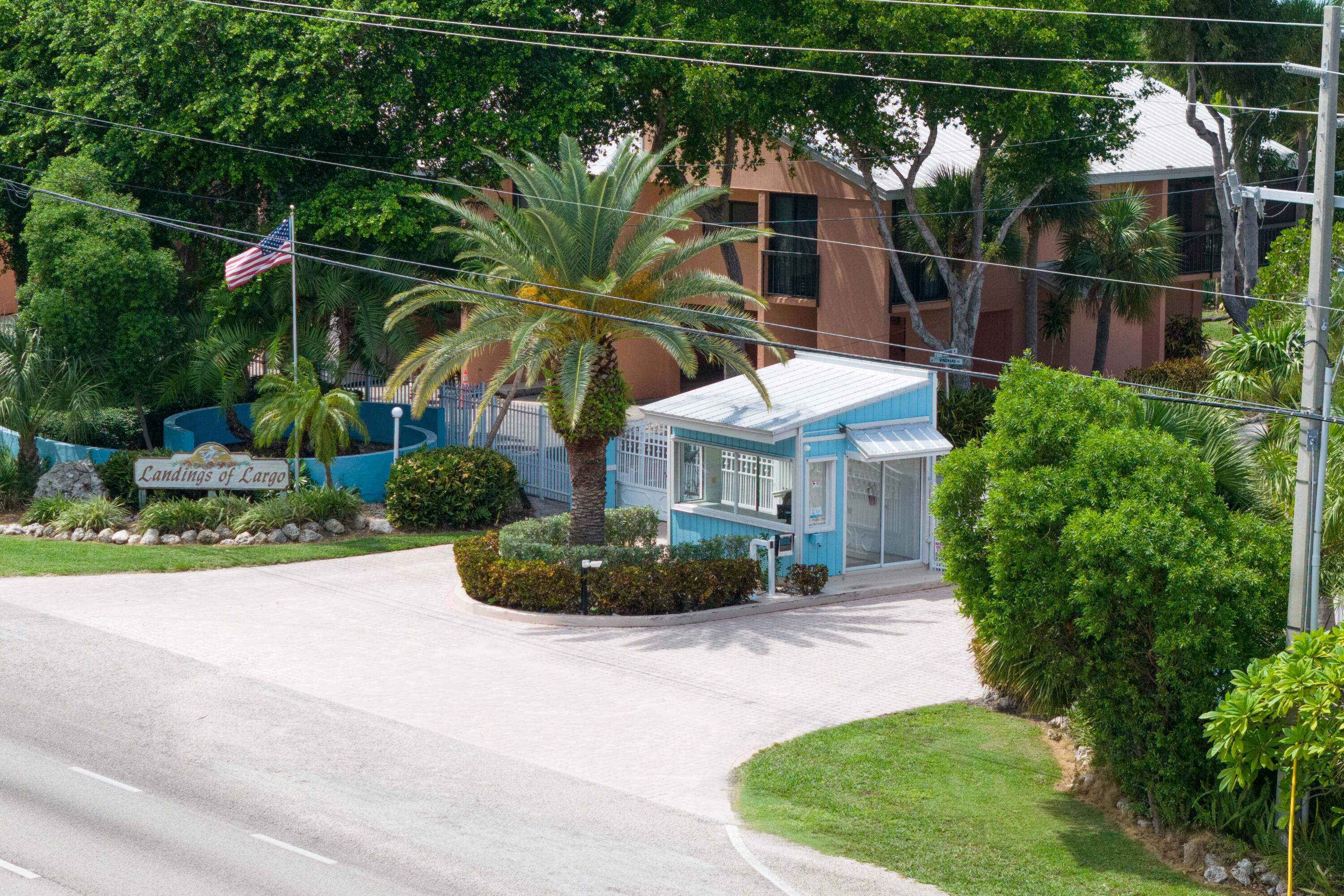 9871 Leeward Avenue Key Largo, FL 33037 - Photo 31 of 38 a front view of a house with garden