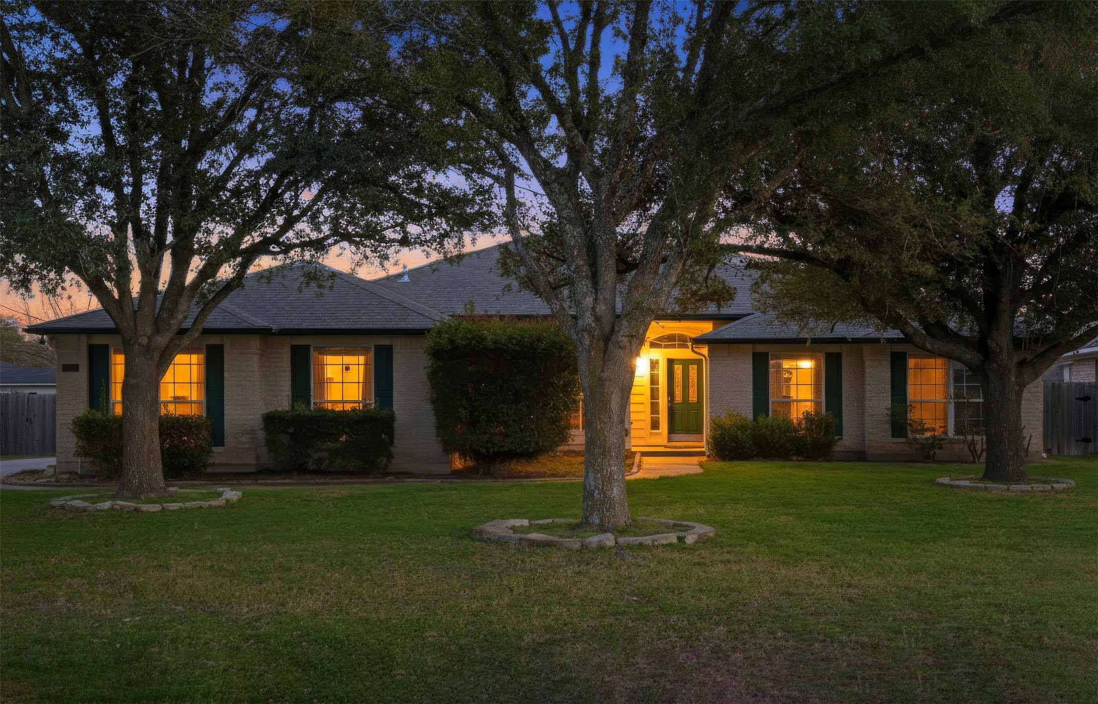 View of front of house with a front lawn and brick siding