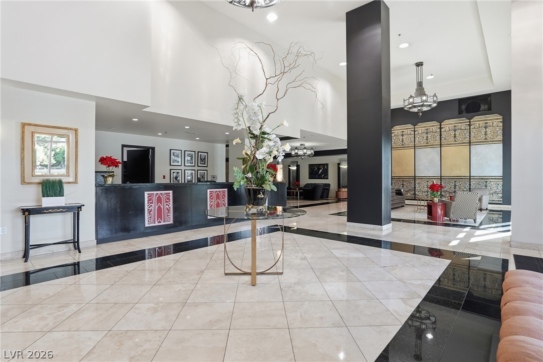360 East Desert Inn Road, Unit 1701 Las Vegas, NV 89109 - Photo 5 of 33 A grand entrance with high ceilings and lustrous tile flooring welcomes all who enter.