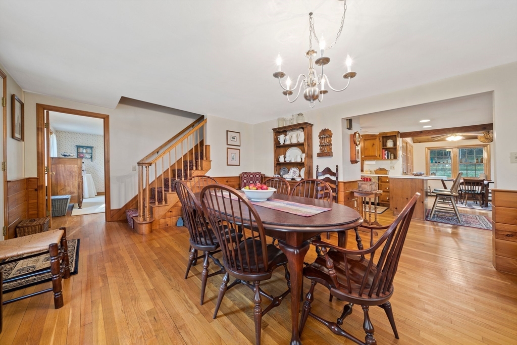 95 Wapping Road Kingston, MA 02364 - Photo 11 of 42 a view of a dining room with furniture wooden floor and chandelier