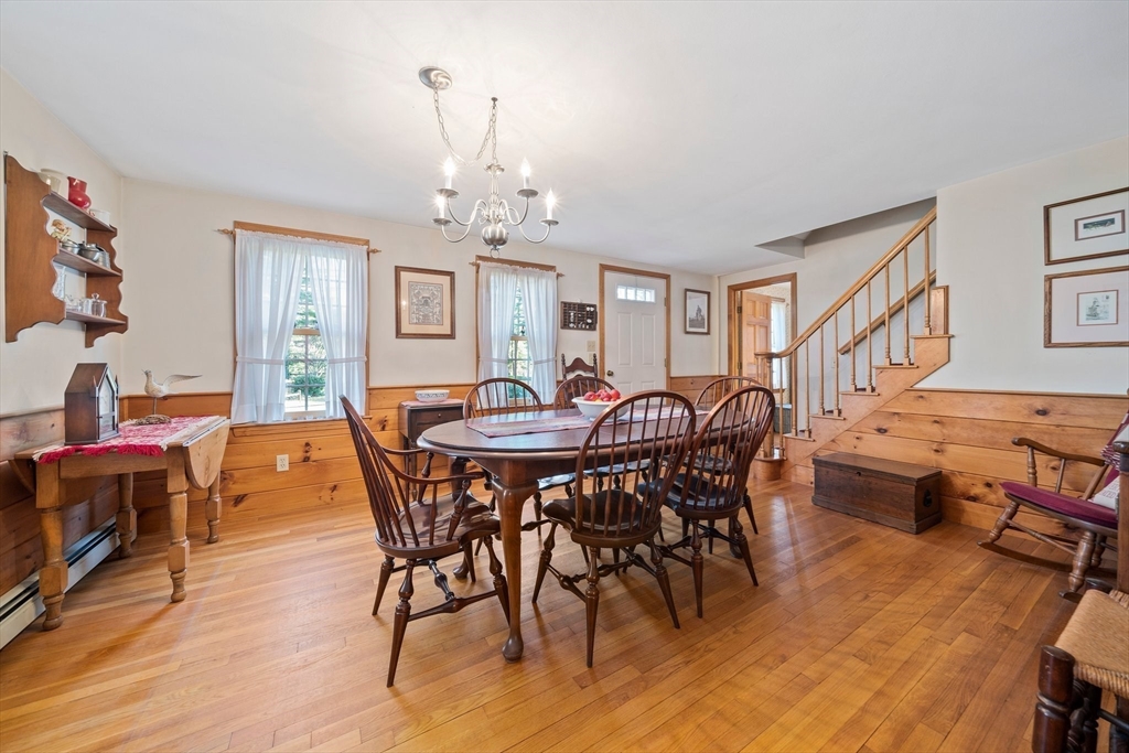 95 Wapping Road Kingston, MA 02364 - Photo 13 of 42 a view of a dining room with furniture window and wooden floor