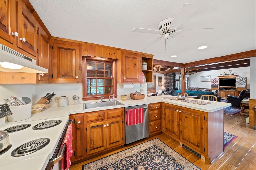 95 Wapping Road Kingston, MA 02364 - Photo 14 of 42 a kitchen with a sink appliances and cabinets