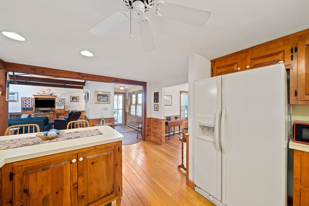 95 Wapping Road Kingston, MA 02364 - Photo 15 of 42 a view of living room with furniture a flat screen tv and a refrigerator