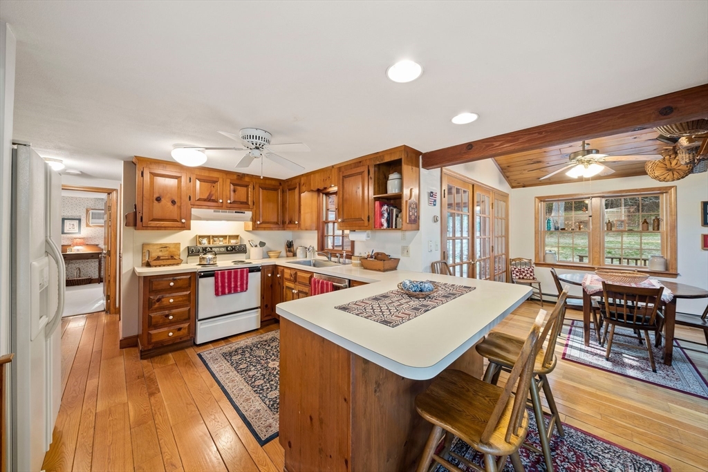 95 Wapping Road Kingston, MA 02364 - Photo 17 of 42 a view of a dining room with furniture window and wooden floor