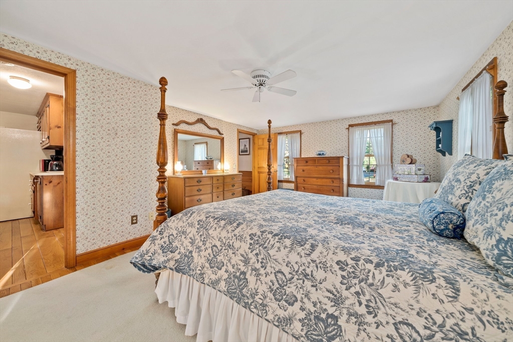 95 Wapping Road Kingston, MA 02364 - Photo 20 of 42 a bedroom with a large bed and a dresser