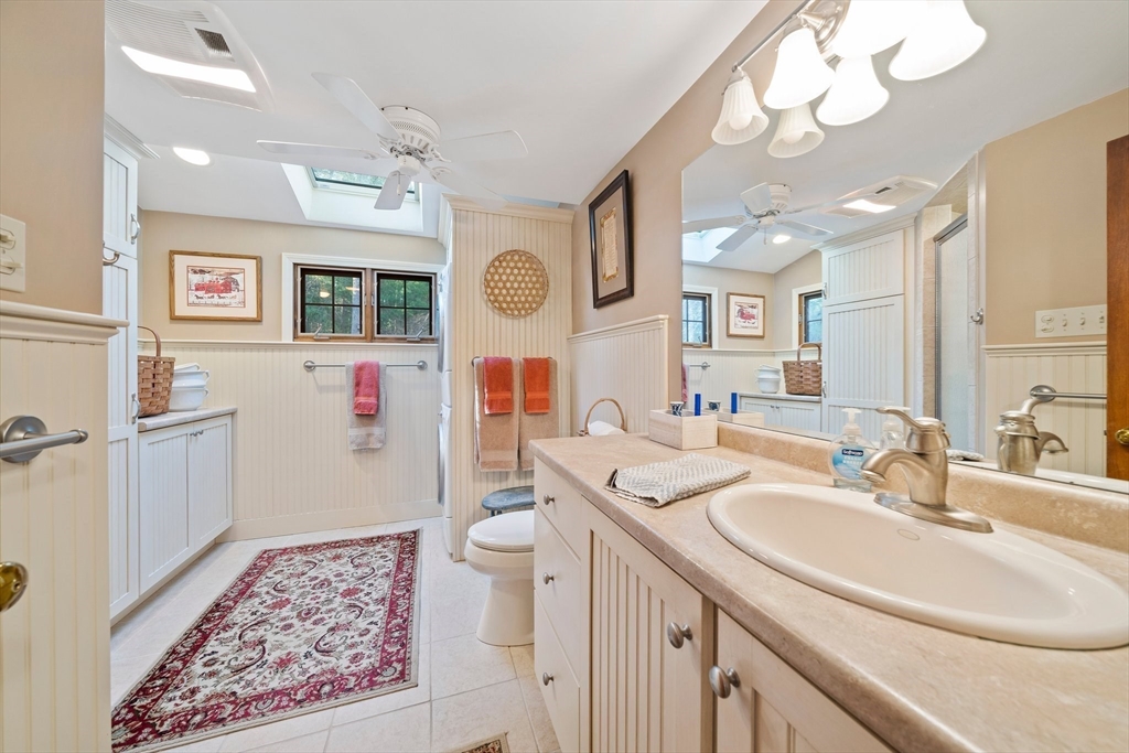 95 Wapping Road Kingston, MA 02364 - Photo 26 of 42 a bathroom with a sink a mirror and a shower in it