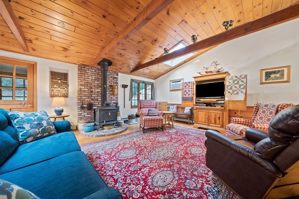 95 Wapping Road Kingston, MA 02364 - Photo 7 of 42 a living room with furniture and a flat screen tv