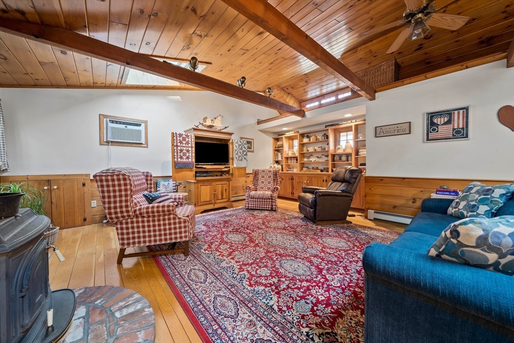 95 Wapping Road Kingston, MA 02364 - Photo 10 of 42 a living room with furniture and a flat screen tv