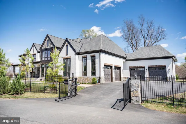 a view of a house with a patio and a yard