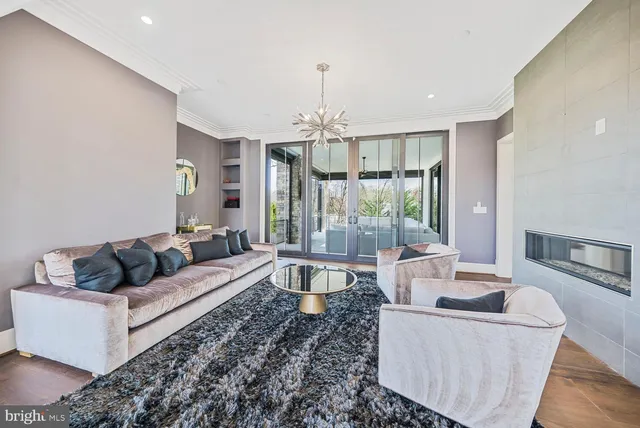 a large white kitchen with a sink and cabinets