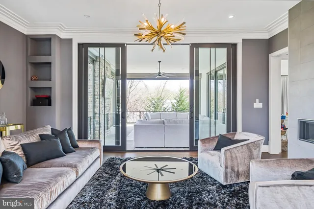 a large white kitchen with a large window