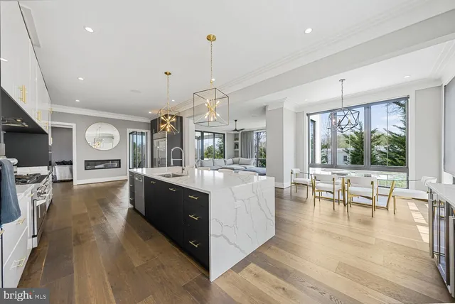 a kitchen with stainless steel appliances granite countertop a stove and a refrigerator
