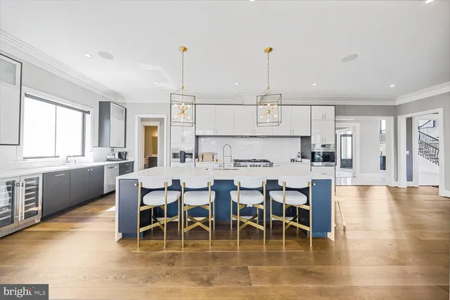 a living room with large window and a table