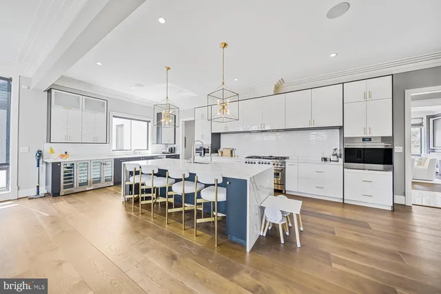 a view of a workspace with furniture and a rug
