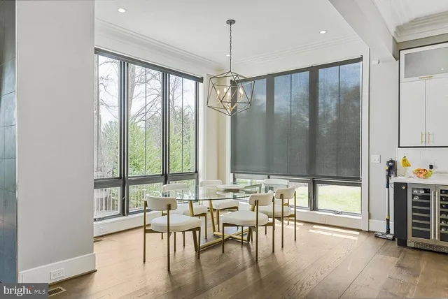 a bedroom with a large bed and a large window