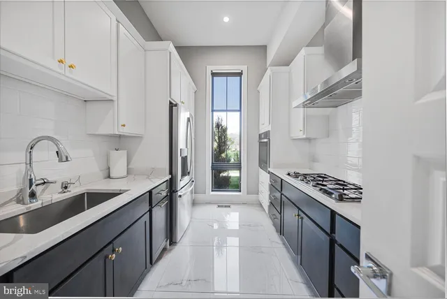 a living room with furniture tv and a large window