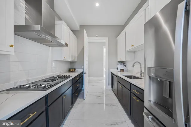 a living room with a couch and a chandelier