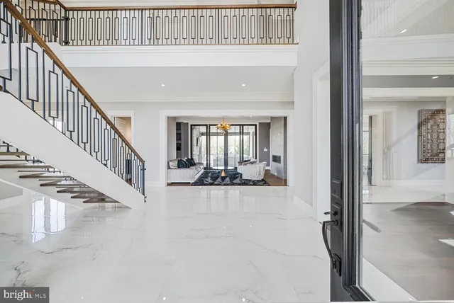 a living room with furniture and a kitchen