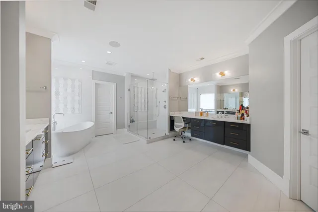 a bathroom with a sink a toilet a tub and shower