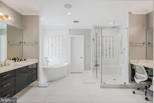 a view of a house with a big yard and large trees