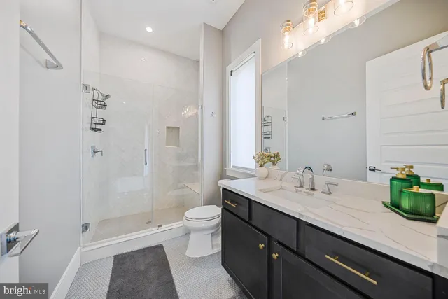 a view of a big house with a big yard and large tree