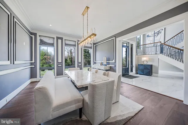 a living room with patio furniture and a large window