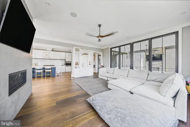 a kitchen with a sink a counter top space and a wooden floor