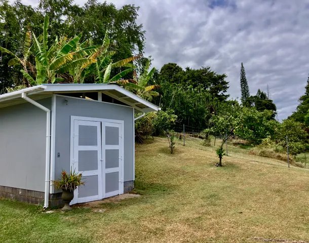 a kitchen with stainless steel appliances a refrigerator a stove a sink and a dining table with granite countertops